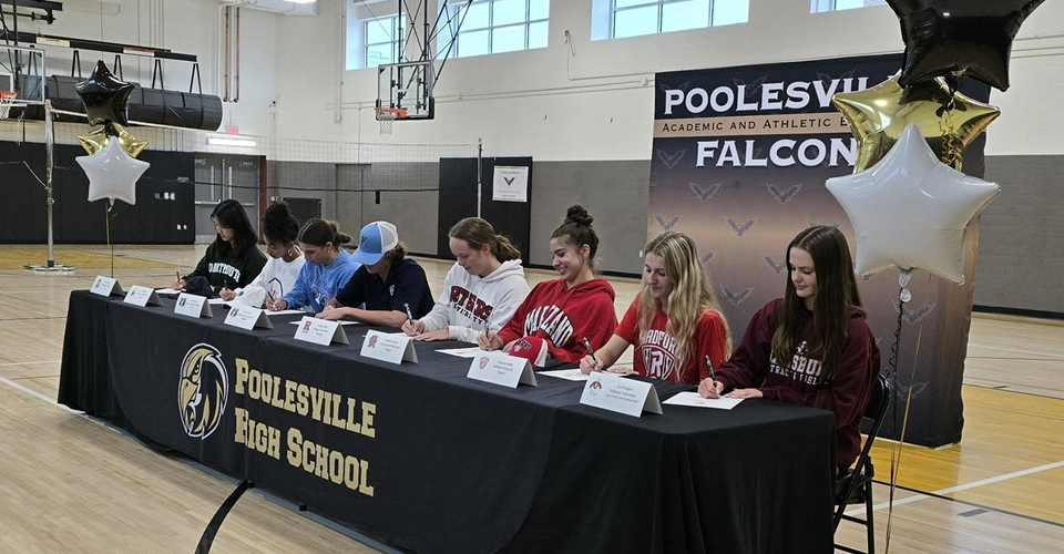 image or senior athletes signing for their respective colleges or universities.