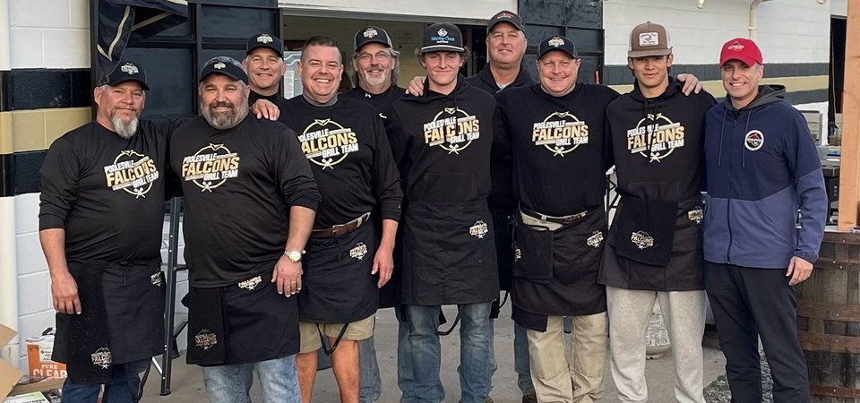 photo of the members of the Poolesville grill team along with M C P S director of systemwide athletics, Jeff Sullivan